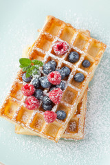 Fresh homemade brussels waffle with berries - 76986183