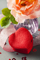 Heart shaped gift box and rose in vase, Valentine's Day concept