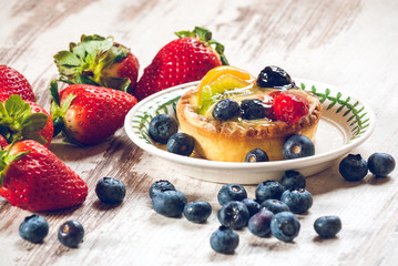 Delicious cookie made shortcrust pastry with fresh fruit, strawb