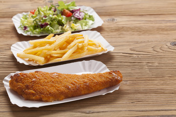 Fried fish and chips on a paper tray
