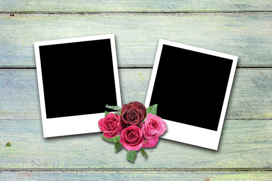 Blank valentine photo frames on wood background