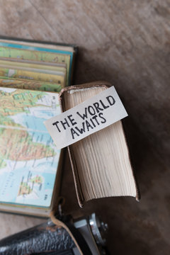 text The World Awaits, travel concept