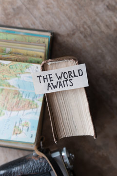 text The World Awaits, travel concept