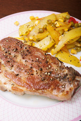 Juicy pork steak and homemade fries