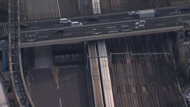 Aerial TGV Bullet trains downtown Tokyo elevated highway Japan 