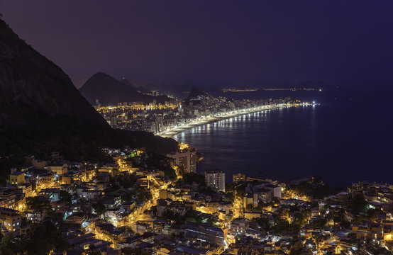 Night panorama of Rio de Janeiro with water reflections, Brazil