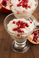Dish of banana millet breakfast pudding with pomegranate