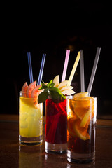 Cherry bomb, screwdriver and cuba libre cocktails in a tall glas