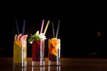 Cherry bomb, screwdriver and cuba libre cocktails in a tall glas