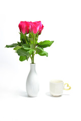 tea cup of love and pink rose in vase