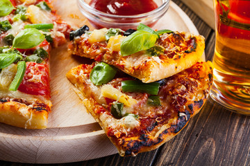 Pizza hawaii with beer