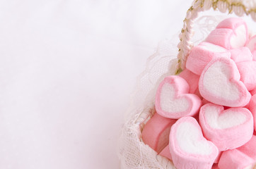 Fototapeta na wymiar Pink heart marshmallow in Vintage basket