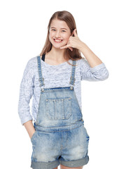 Fototapeta premium Young teenage girl with call gesture isolated