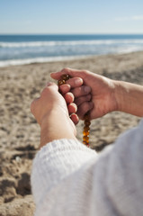 girl holding a rosary
