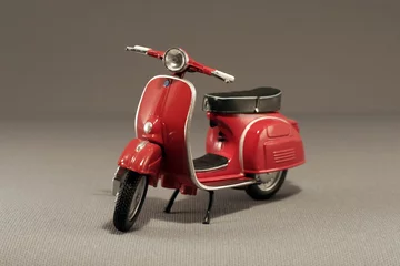 Foto op Plexiglas Rode oude scooter geïsoleerd op grey © jiortola