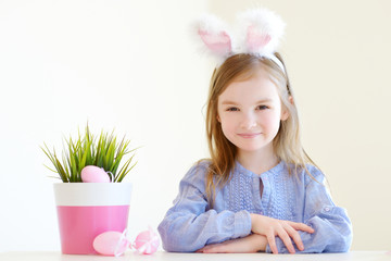 Adorable little girl wearing bunny ears on Easter © MNStudio