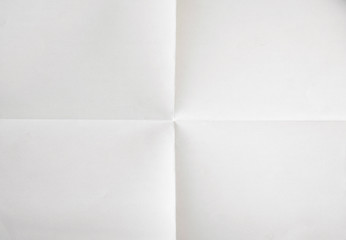 white sheet of paper folded in four