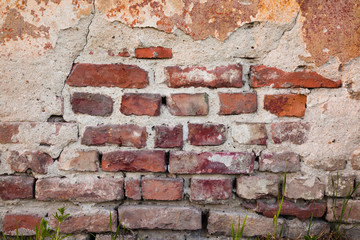 Old grunge brick wall and plaster