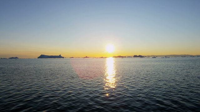 Greenland sunset Climate global weather drifting ice floes fjord 