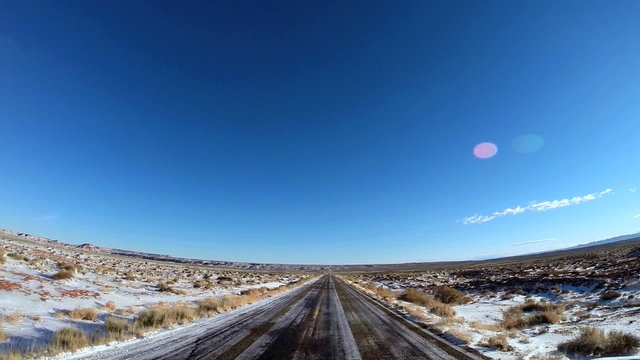 POV road driving desert winter  snow Colorado Plateau Monument Valley Arizona USA