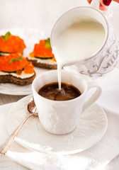 Romantic breakfast with coffee and toasts