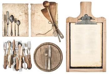 kitchen board, aged recipe paper and vintage cutlery