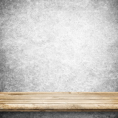 Wood table and blue concrete wall