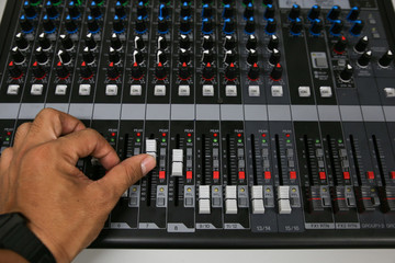 Hand on a Mixing Desk Fader in Television Gallery,
