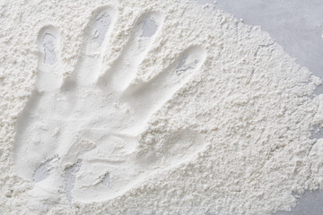Hand print on flour