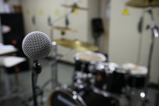 Close up of microphone in concert hall or conference room.