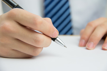 Businessman signing documents in the office