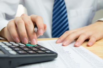 Businessman calculating the financial statements