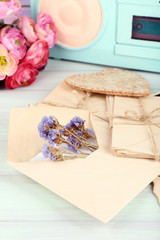 Vintage memories with flowers on wooden background