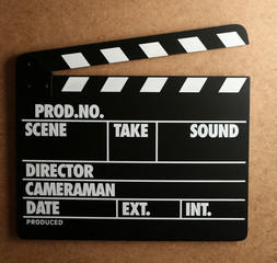 Fototapeta premium Movie clapper on wooden background