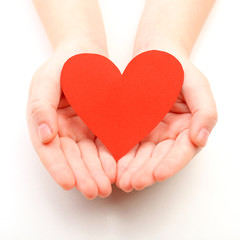 Obraz premium Heart in child hands isolated on white