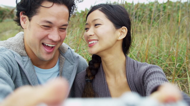 Portrait Close Up Asian Chinese Young Couple Smiling Filming Selfie