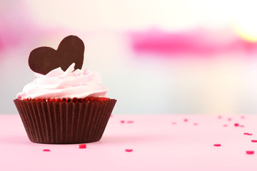 Delicious cupcake for Valentine Day on bright background