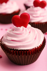 Delicious cupcake for Valentine Day on pink background