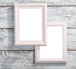 Photo frames on color wooden background