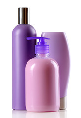 Cosmetic bottles on light background
