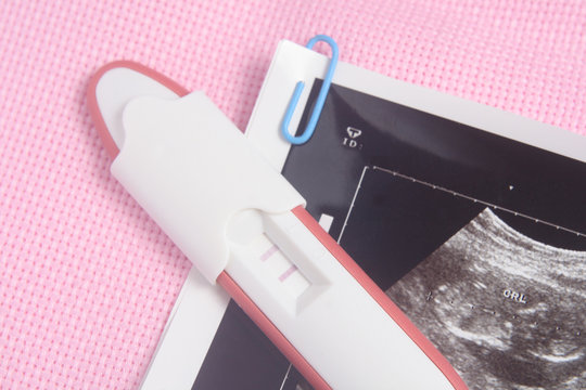Pregnancy Test Pack At Pink Background