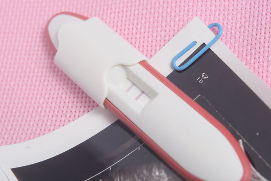 Pregnancy Test Pack At Pink Background