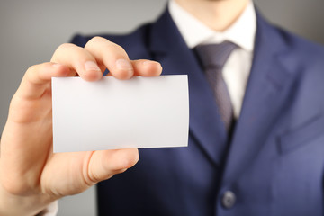 Businessman with business card, close-up