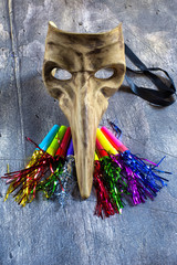 Classical venetian carnival mask and blowers