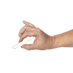 hand using a small tweezers