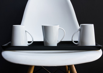 Three white mugs on tray