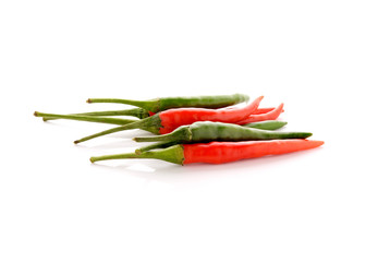 red and green hot chili peppers with stem on white background