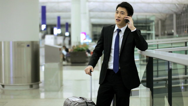 Asian Chinese Businessman Airport Global Travel Smart Phone Communication
