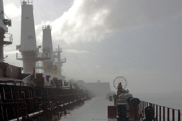 a flurry of wind and rain on the ship
