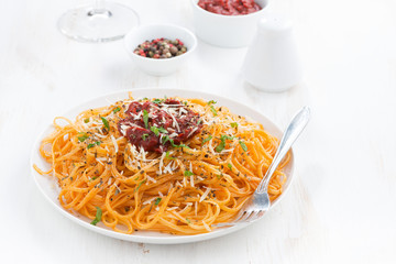 spaghetti with tomato sauce and parmesan